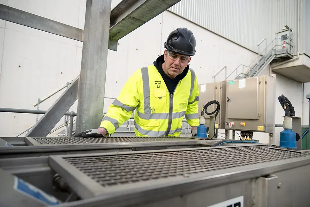 Employee working outside in a hi-vis vest