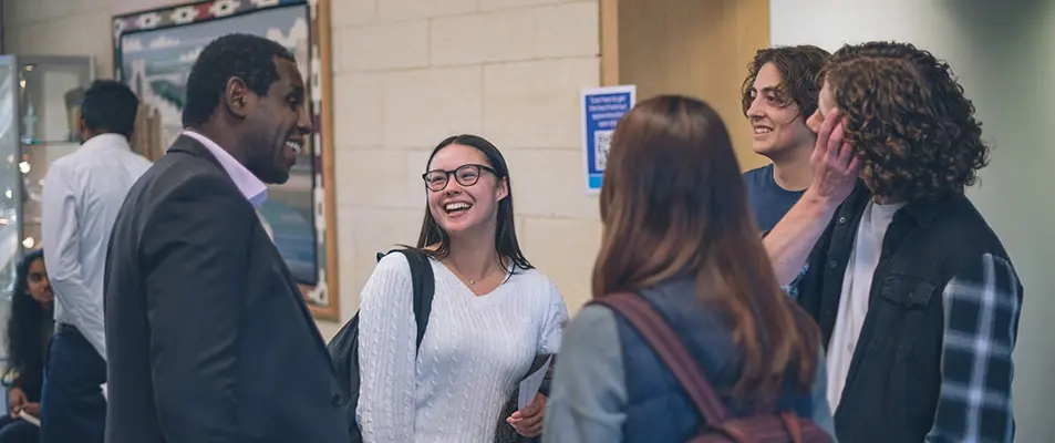 Graduates talking to Wessex Water staff at a graduates open evening
