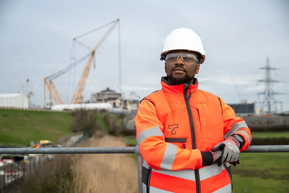 Turnbull employee in an orange hi-vis