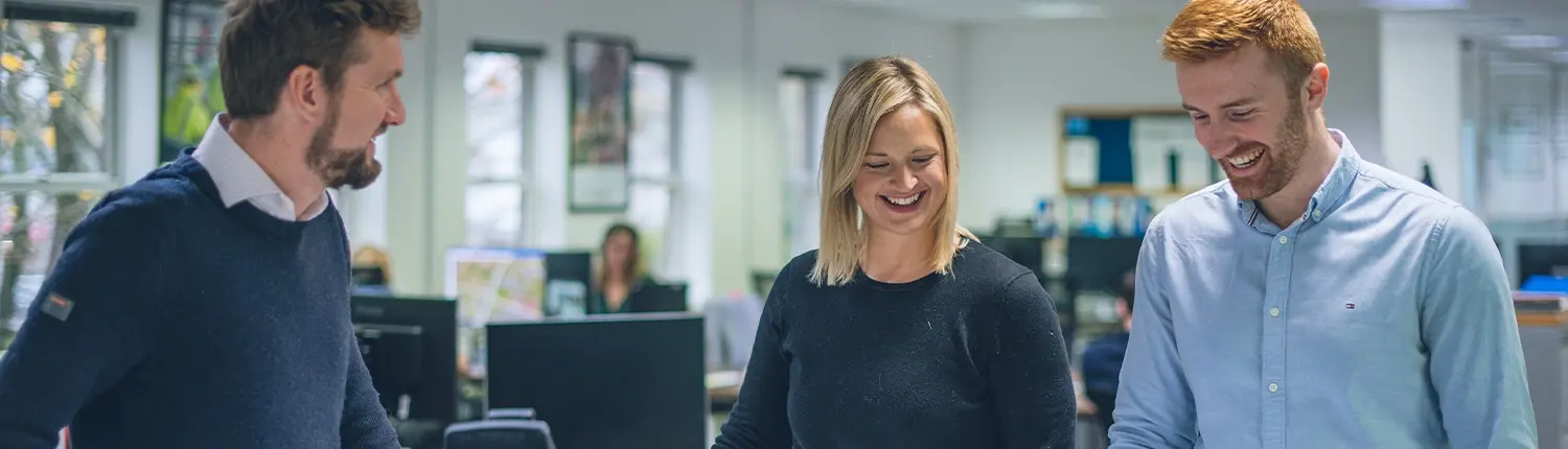 Employees talking and laughing in the office