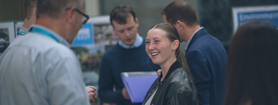 Girl smiling and walking to a Wessex Water employee during our Apprenticeship Open Day