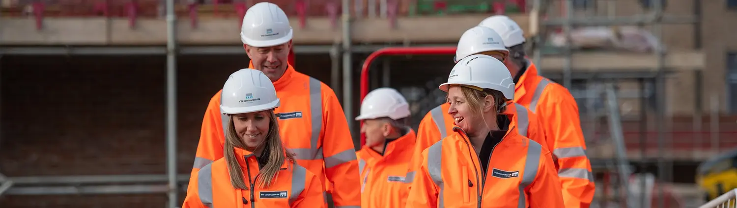 Employees in hi vis on a construction site