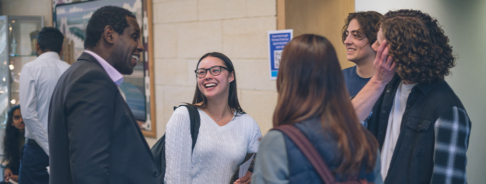 Graduates talking to Wessex Water staff at a graduates open evening