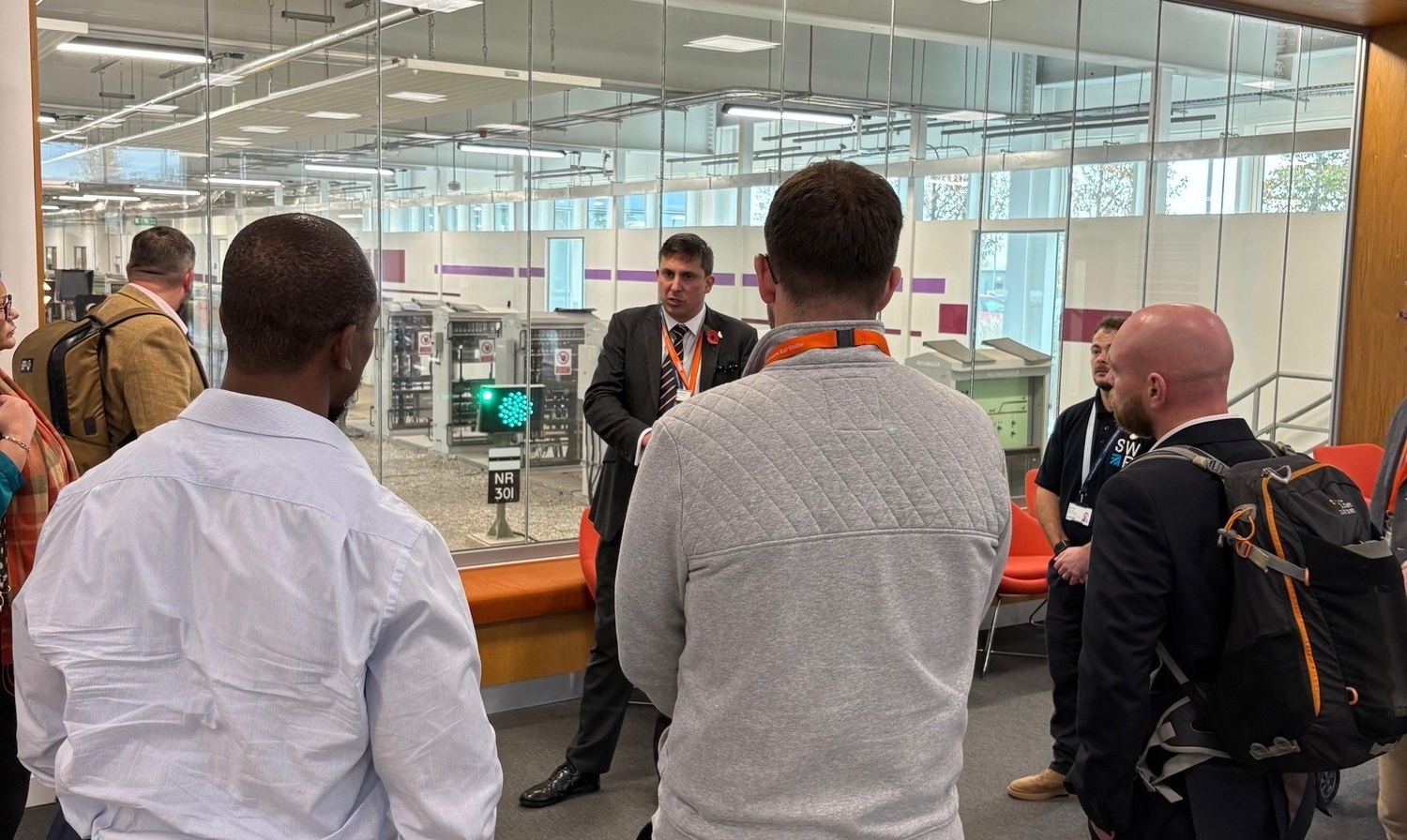 Airport, Adult, Male, Man, Person, Shoe, Tie, Indoors, Coat, Glasses