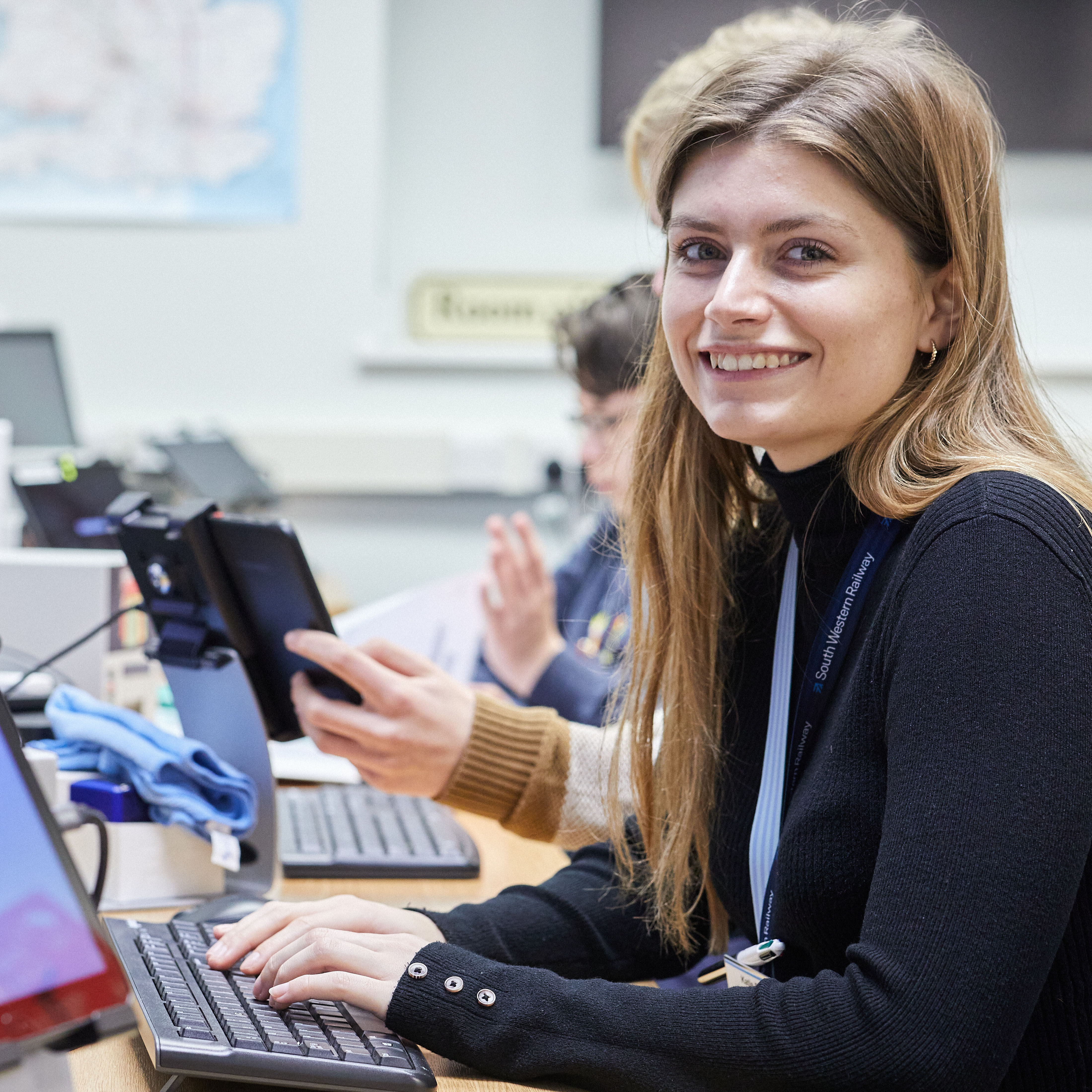 Adult, Female, Person, Woman, Computer Keyboard, Face, Desk, Executive, Mobile Phone, Laptop