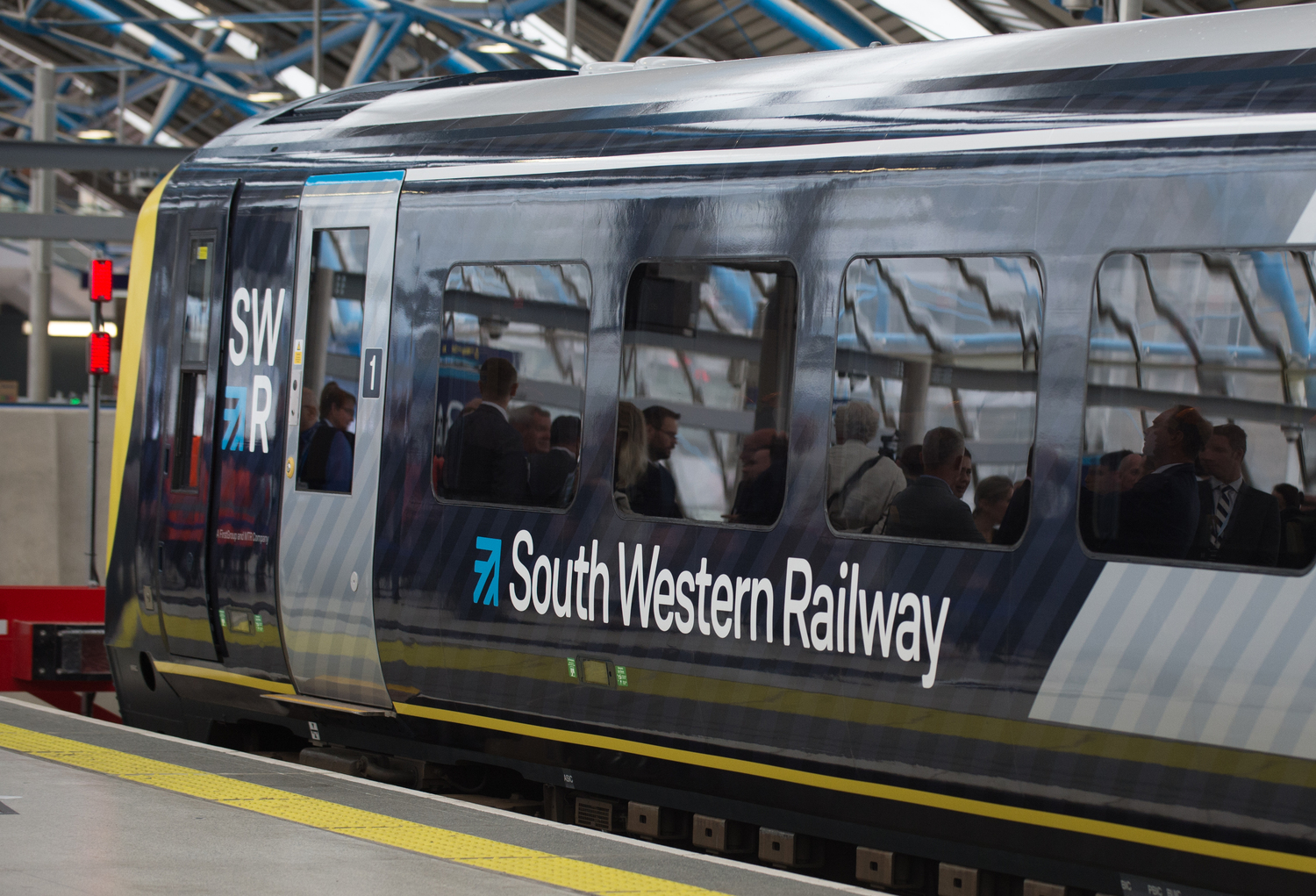 Terminal, Railway, Train, Train Station, Vehicle, Person, Glasses, Face, Tie, Suit