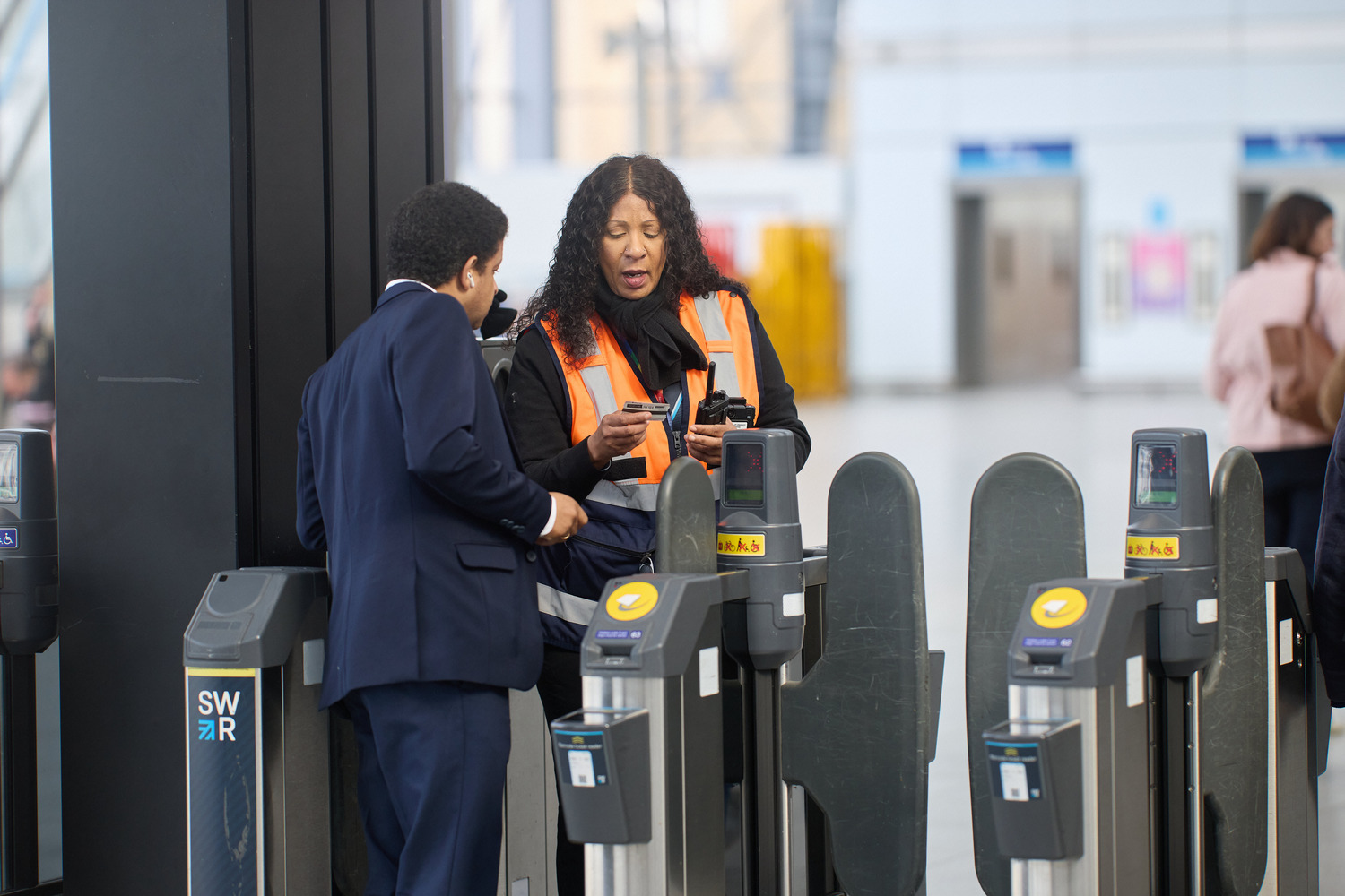 Airport, Adult, Female, Person, Woman, Male, Man, Mobile Phone, Handbag, Crowd