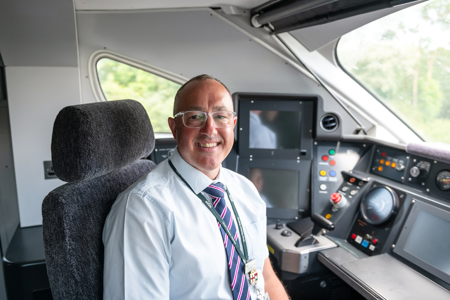 Adult, Male, Man, Person, Captain, Tie, Cushion, Glasses, Chair, Monitor