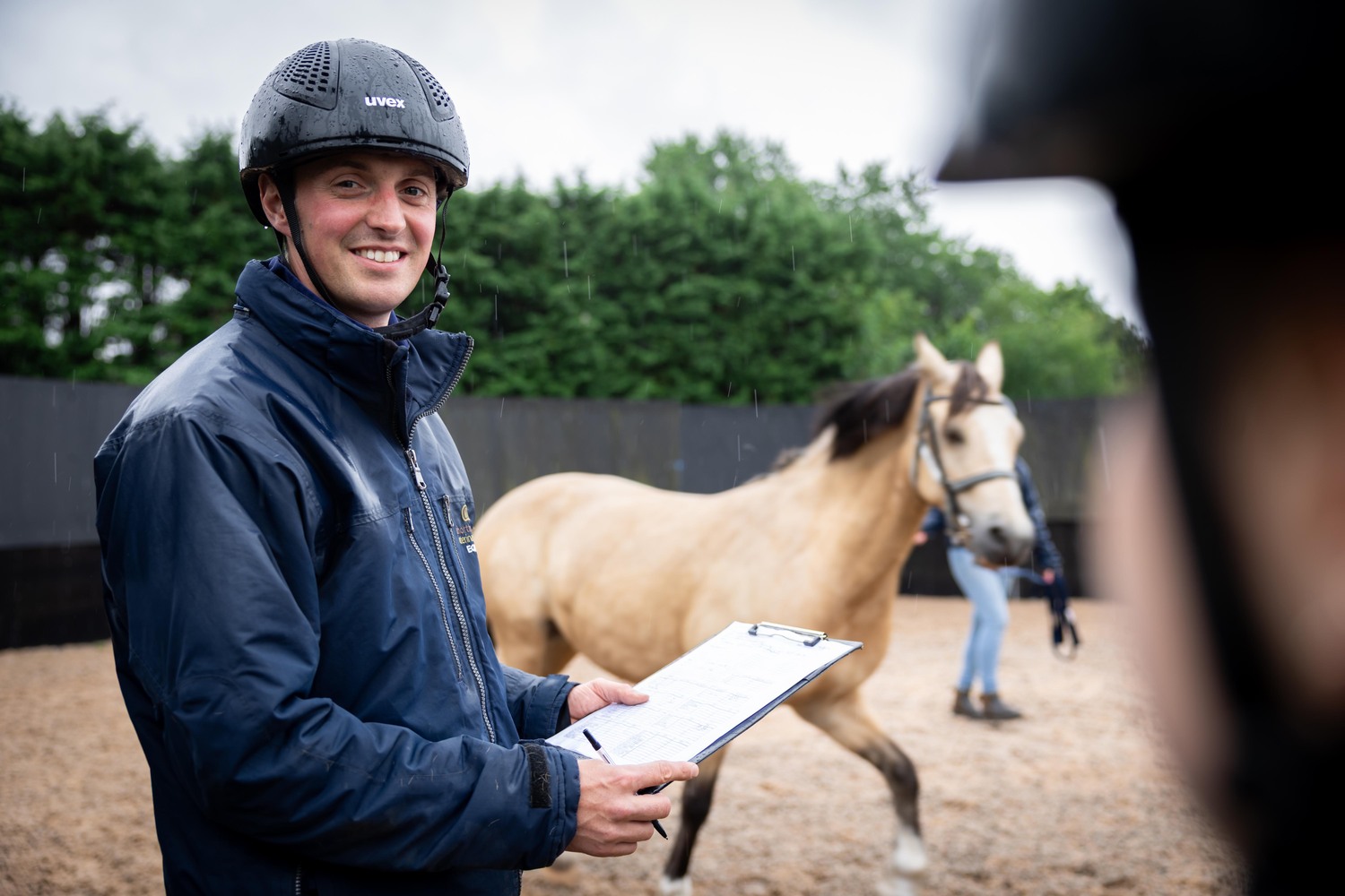 Helmet, Adult, Male, Man, Person, Pen, Horse, Mammal, Shoe, Coat