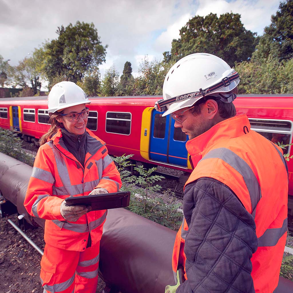 Person, Worker, Adult, Male, Man, Clothing, Glove, Gun, Helmet, Train