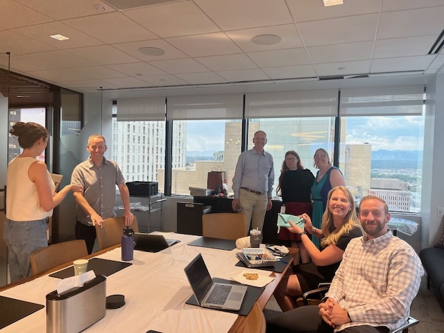 Monica at the office with colleagues