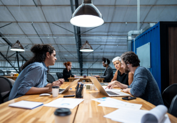 Adult, Female, Person, Woman, Conversation, Laptop, Mobile Phone, Tabletop, Indoors, Chair