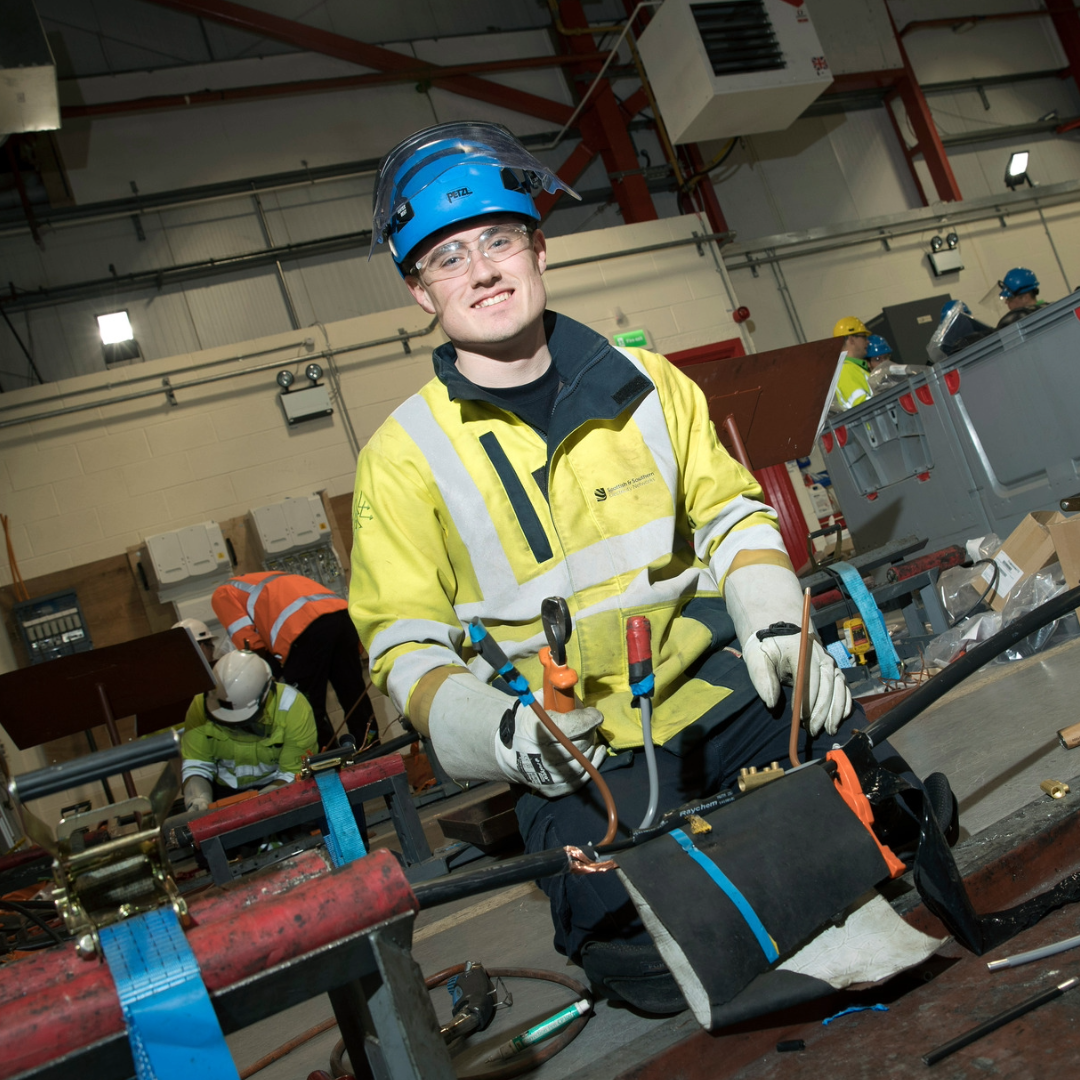 A group of SSE apprentices and trainees standing together and smiling