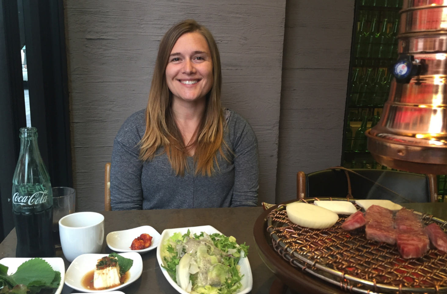 Julia eating Korean BBQ abroad