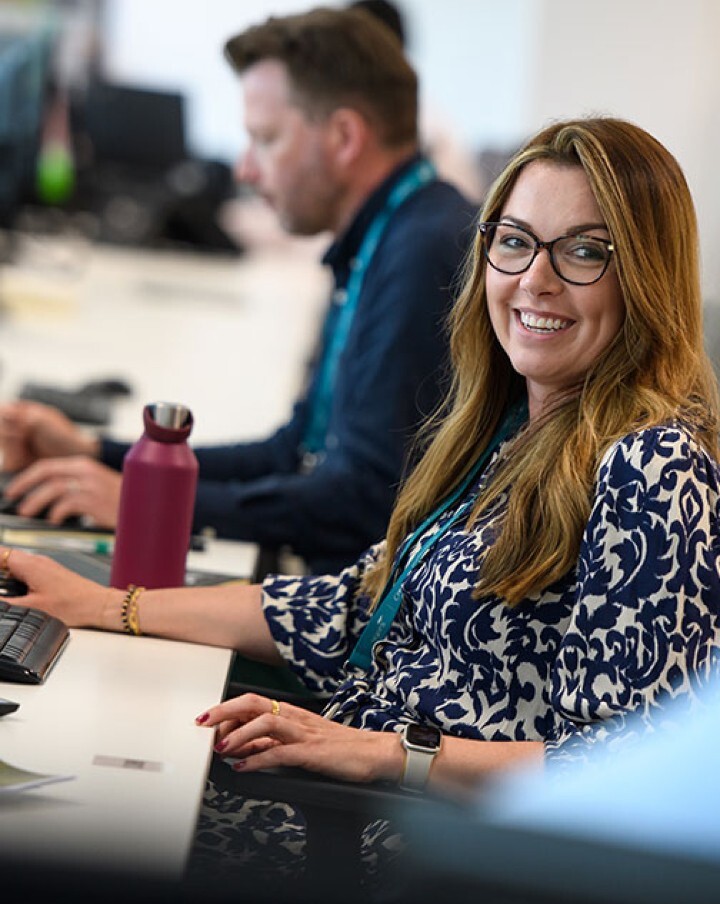 Adult, Female, Person, Woman, Male, Man, Student, Face, Desk, Smile
