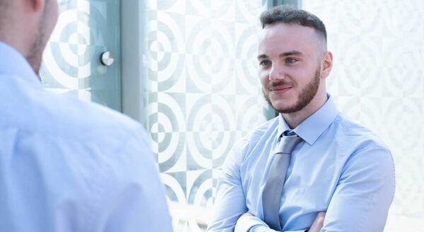 Man smiling at a trainee induction day