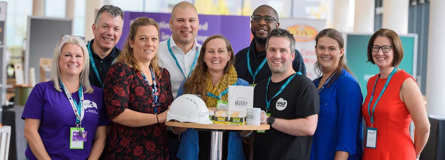 A diverse group of people smiling