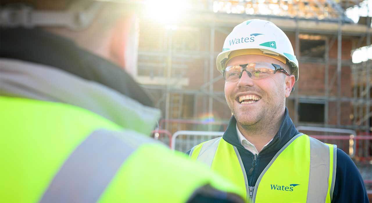 A Wates worker smiling on site
